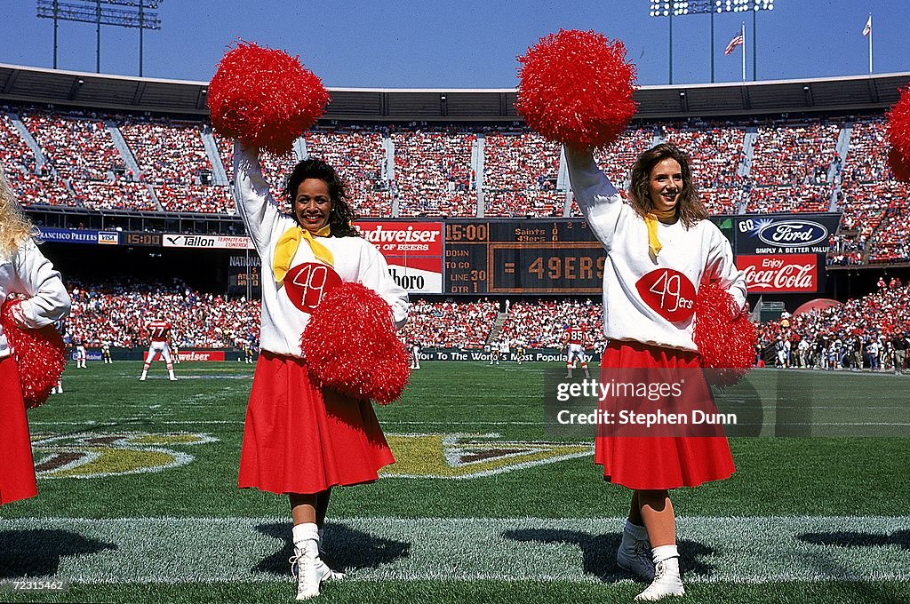 49ers Cheerleaders are dressed in old-style uniforms during the