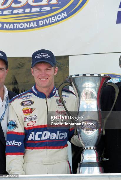 Dale Earnhardt Jr. Poses with the winning trophy after winning the Busch Series during the Hot Wheels.Com 300, part of the NASCAR Busch Series at the...