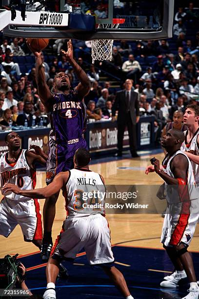 Alton Ford of the Phoenix Sus drives to the basket for a layup against the Golden State Warriors during the NBA Game at The Arena In Oakland in...