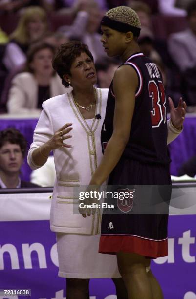 Head coach Vivian Stringer talks with Kourtney Walton of Rutgers during a timeout against Tennessee during the NCAA Women''s Final Four at the First...