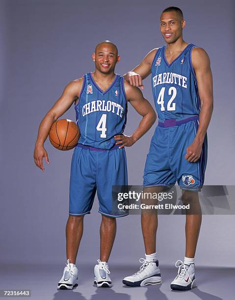 Guard David Wesley of the Charlotte Hornets and his teammate, forward Kwame Brown, pose for a studio portrait during the Charlotte Hornets Photo...