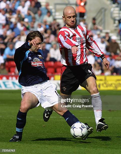 Giorgi Kinkladze of Derby County is quickly closed down by Chris Marsden of Southampton during the FA Barclaycard Premiership match played at the St...