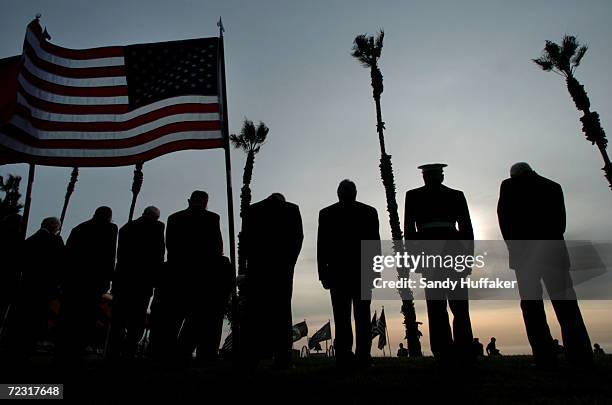 Veterans from the battle of Iwo Jima listen pay respects to the fallen during a sunset memorial on March 26, 2005 at Camp Pendleton, California....