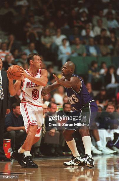 Dan Majerle of the Miami Heat looks to throw the ball while Glenn Robinson of the Milwaukee Bucks blocks him during their 101-89 victory over the...