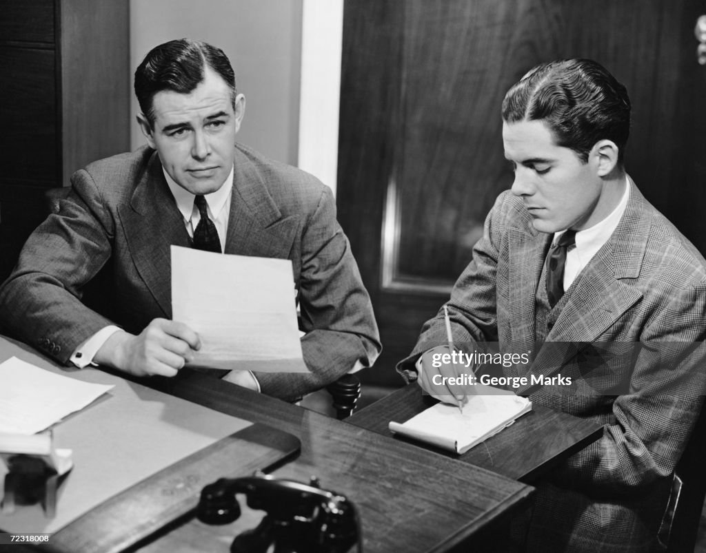 Male stenographer taking dictation