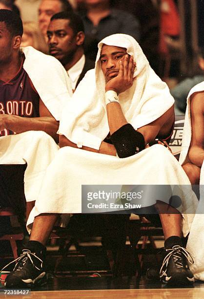 Vince Carter of the Toronto Raptors sits on the bench after picking up his third foul in the second period of their game against the New York Knicks...