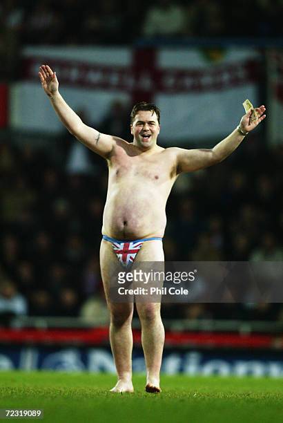 An England fan runs onto the pitch during the International Friendly match between England and Australia held on February 12, 2003 at Upton Park, in...