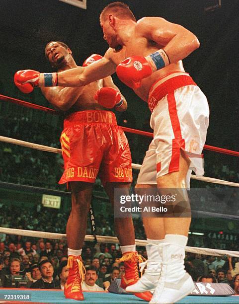 Andrew Golota tags Riddick Bowe with a right hand during their return bout at the Atlantic City Convention Center in Atlantic City, New Jersey.