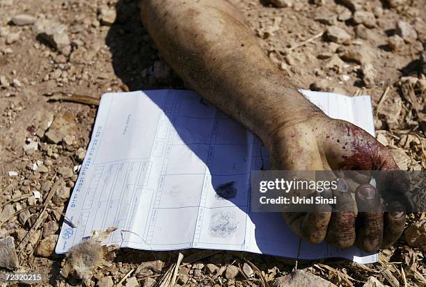 The hand of a suicide bomber is seen on the ground with a sheet of fingerprints after he exploded himself near an Israeli Defence Force checkpoint...