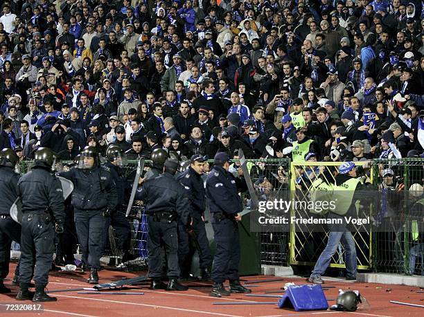 Riot police contain Sofia supporters during the UEFA Champions League Group A match between Levski Sofia and Werder Bremen at the Vasil Levski...