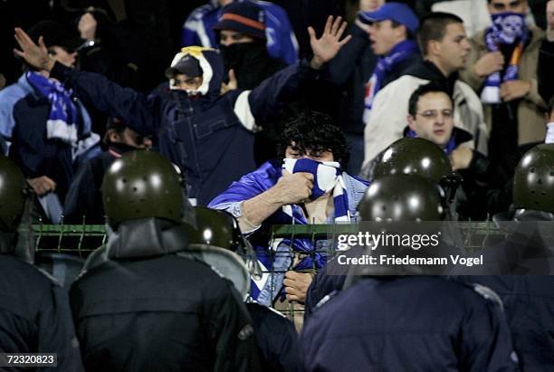 Riot police contain Sofia supporters during the UEFA Champions League Group A match between Levski Sofia and Werder Bremen at the Vasil Levski...