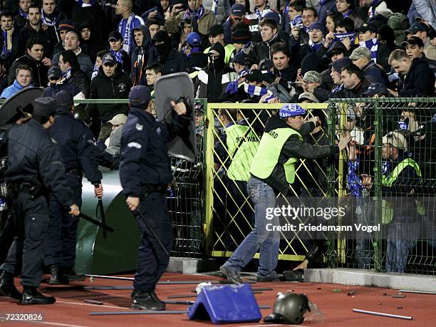 Riot police contain Sofia supporters during the UEFA Champions League Group A match between Levski Sofia and Werder Bremen at the Vasil Levski...