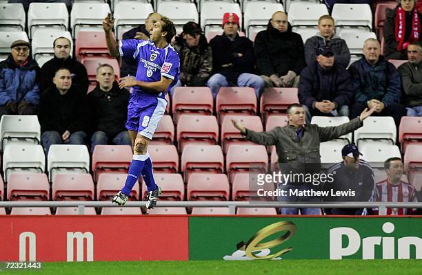 Michael Chopra of Cardiff celebrates his second goal, as a Sunderland fan looks on during the Coca-Cola Championship match between Sunderland and...