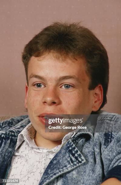 British actor, Warwick Davis, star of Ron Howard's film "Willow," poses during a 1988 photo portrait session in Los Angeles, California. Davis is...