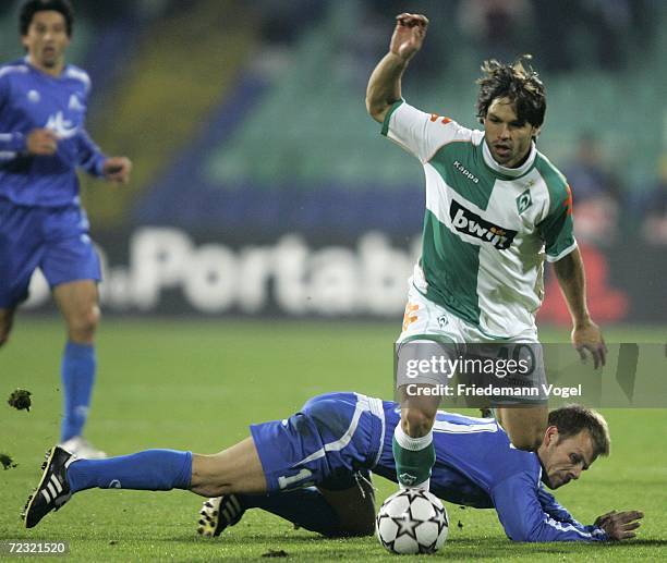 Diego of Bremen tussles for the ball with Elin Topuzakov of Sofia during the UEFA Champions League Group A match between Levski Sofia and Werder...