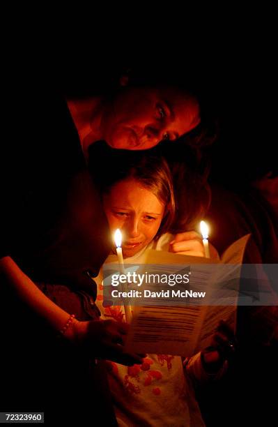 Jill Ward comforts her nine-year-old daughter, Jessica, a school aquaintance of missing seven-year-old Danielle van Dam, during a prayer vigil for...
