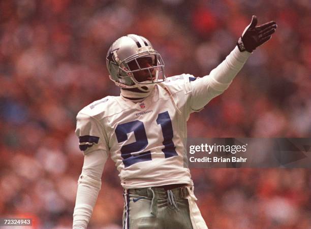 Deion Sander of the Dallas Cowboys signals a first down during the Cowboys 21-10 win over the Washington Redskins at Texas Stadium in Irving, Texas....