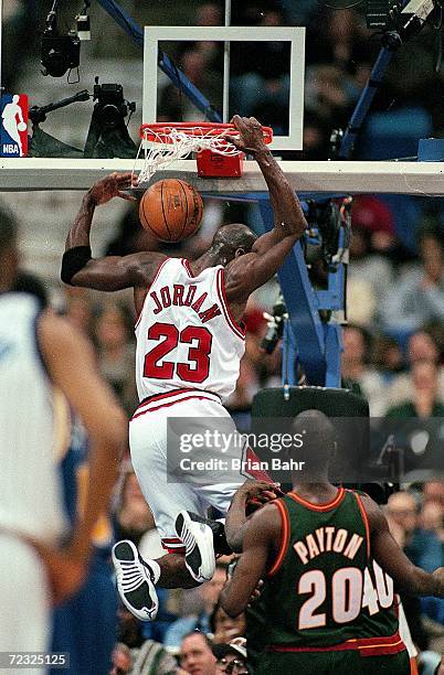 Michael Jordan of the East dunks the ball during the NBA All-Stars Game against the West at the Gund Arena in Cleveland, Ohio. The East defeated the...