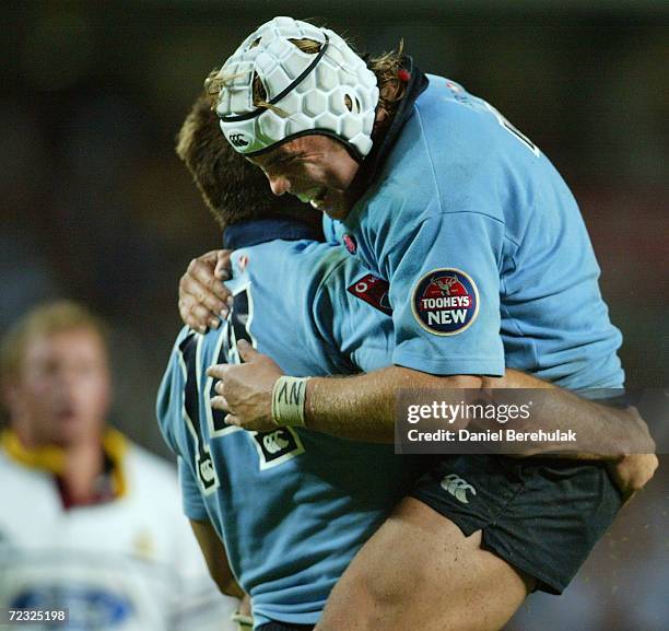 Scott Staniforth celebrates with Phil Waugh of the Waratahs after his try during the Super 12's match between the Waratahs v Otago Highlanders played...