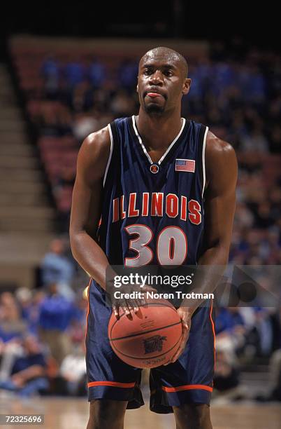 Guard Frank Williams of the Illinois Fighting Fighting Illini attempts a free throw during the NCAA game against the Seton Hall Pirates at the...