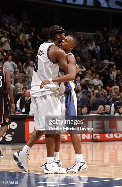 Chris Whitney hugs Tyrone Nesby, both of the Washington Wizards during their game against the Cleveland Cavaliers at MCI Center in Washington, D.C....
