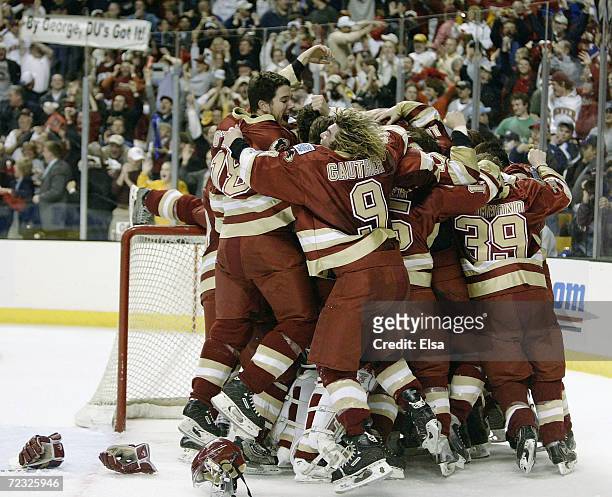 The Denver Pioneers celebrate their win over the Maine Black Bears during the NCAA Frozen Four Championship Game on April 10, 2004 at the Fleet...