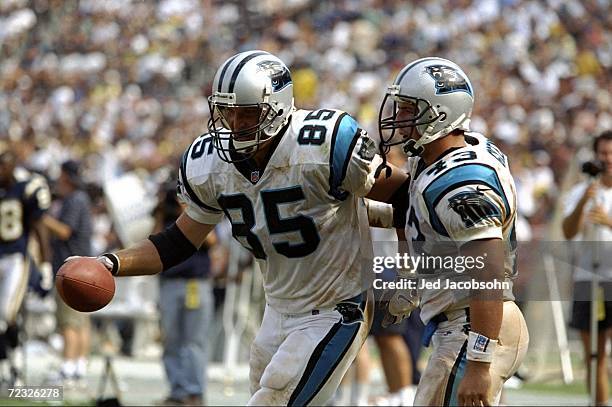 Tight end Wesley Walls and Scott Greene of the Carolina Panthers celebrate during a game against the San Diego Chargers at the Qualcomm Stadium in...
