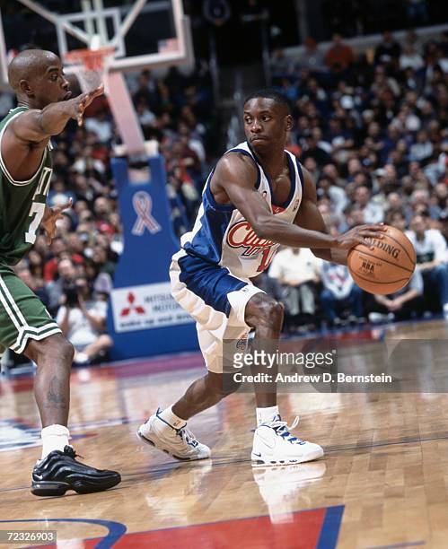 Point guard Earl Boykins of the Los Angeles Clippers posts up point guard Kenny Anderson of the Boston Celtics during the NBA game at the Staples...