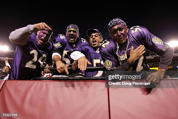 Baltimore Ravens fans celebrate after the Ravens defeated the Washington Redskins 17-10 at FedEx Field on October 10, 2004 in Landover, Maryland.