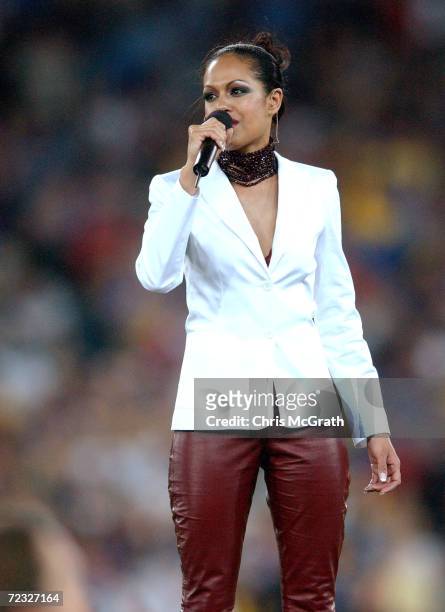 Christine Anu sings the national anthem during the NRL Grand Final between the Parramatta Eels and the Newcastle Knights held at Stadium Australia,...