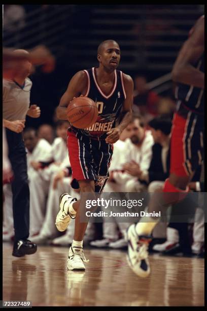 Kenny Smith of the Houston Rockets moves downcourt against the Chicago Bulls during a game played at the United Center in Chicago, Illinois. The...