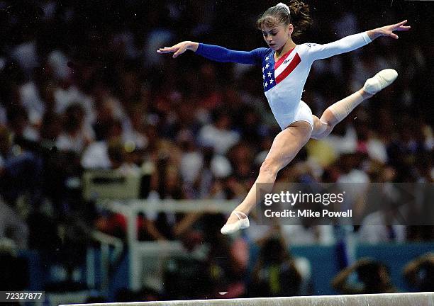 Dominique Moceanu of the USA leaps during the Women's Beam event at the Georgia Dome in the 1996 Olympic Games in Atlanta, Georgia.