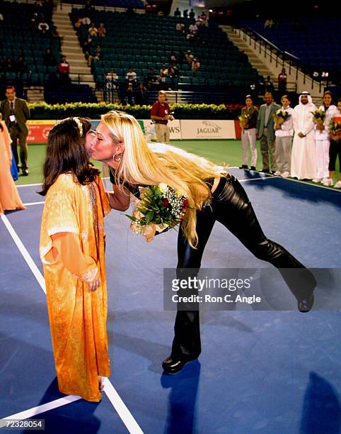 Russian tennis player Anna Kournikova receives flowers from a ball girl during the opening ceremonies of the Dubai Duty Free Womens Tennis Tournament...