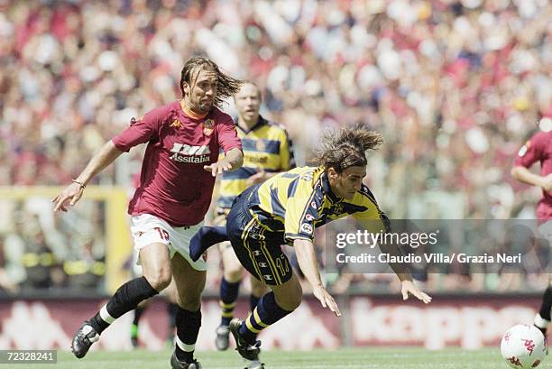 Fabio Cannavaro of Parma is tripped by Gabriel Batistuta of Roma during the Serie A match against Parma at the Stadio Olimpico in Rome. Roma won 3-1...