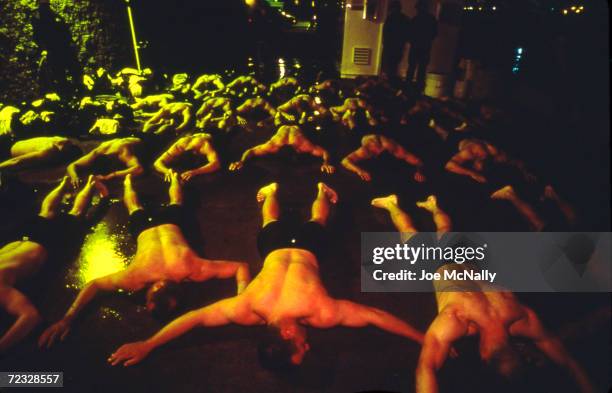 Navy Seal trainees, on orders, lie on a cold, wet concrete floor as part of their training in this undated photo taken in 2000 at the Coronado Naval...