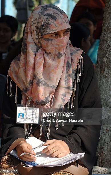 Veiled student at the all female Fatima Jinnah University on the third day of a week long tour of the country on October 31, 2006 in Islamabad,...