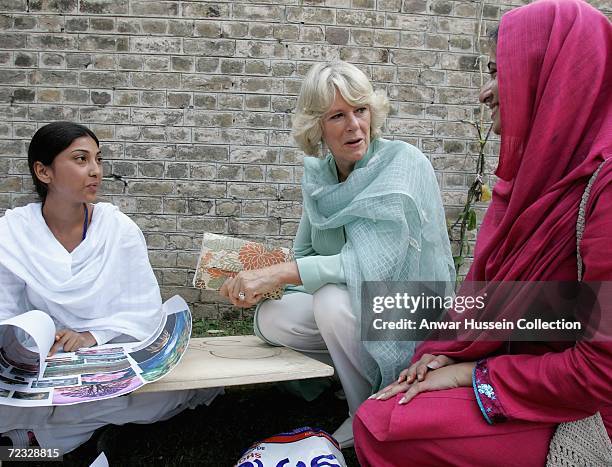 Camilla, Duchess of Cornwall, wearing a traditional Shalwar Kameez, chats to art students at the all female Fatima Jinnah University on the third day...