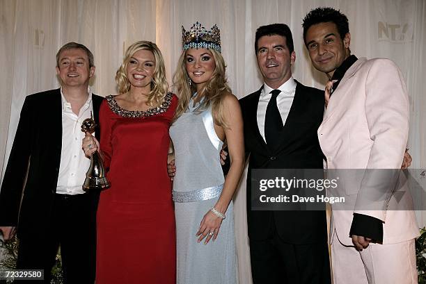 Music producer Louis Walsh, TV presenter Kate Thornton, Miss World 2006 Tatana Kucharova, music producer Simon Cowell and singer Chico Slimani pose...