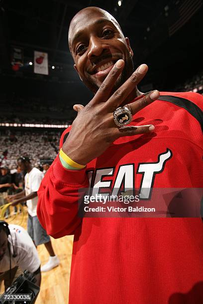 Alonzo Mourning of the Miami Heat shows off his 2006 NBA Championship Ring during the ring ceremony before the start of the Season Opener against the...