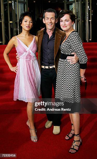 Television presenters Madeleine Wehle, Harald Pignatelli und Angela Fritsch arrive at the "Goldene Henne" awards at the Friedrichstadtpalast on...