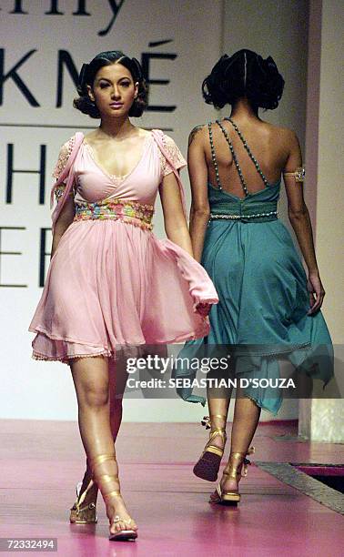 An Indian model displays designer Surily Goel's collection on the second day of Lakme Fashion Week at the National Center for Performing Arts in...