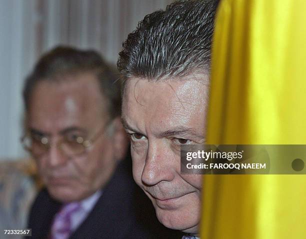 Belgium's Foreign Minister Karl De Gucht and his Pakistani counterpart Khurshid Mahmud Kasuri listen during a joint press conference in Islamabad, 01...