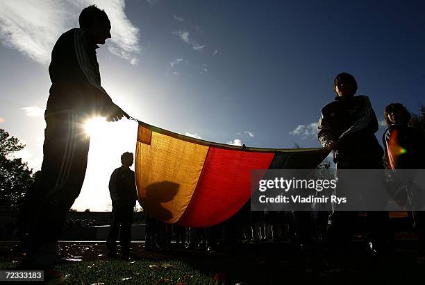 Ball boys hold the German flag prior to the women's U19 international friendly match between Germany and Sweden at the Jahn Stadium on November 1,...