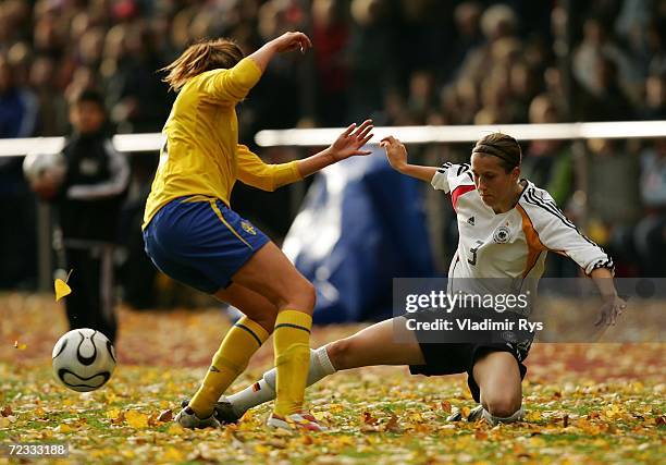 Verena Faisst of Germany falls down as Emma Berglund of Sweden defends during the women's U19 international friendly match between Germany and Sweden...