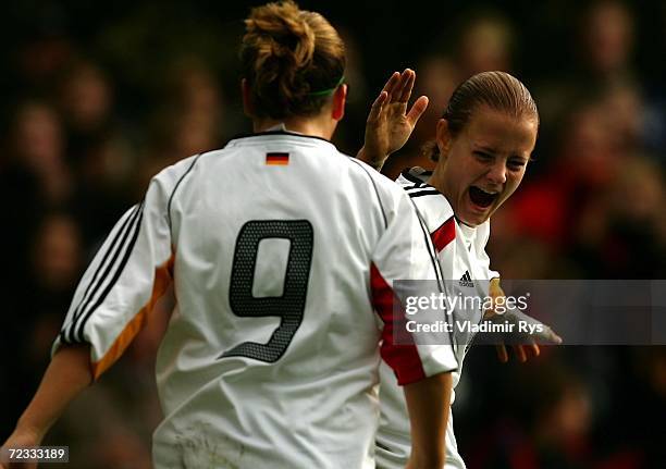 Susanne Hartel celebrates with her team mate Stephanie Goddard of Germany after scoring the first goal during the women's U19 international friendly...