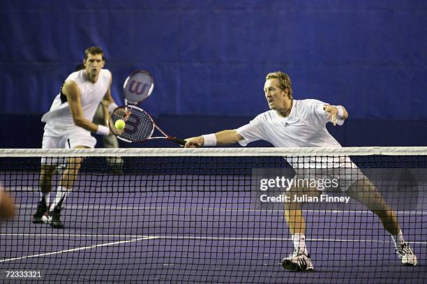 Jonas Bjorkman of Sweden and Max Mirnyi of Belarus in action in their doubles match against Frantisek Cermak and Martin Damm of Czech Republic during...