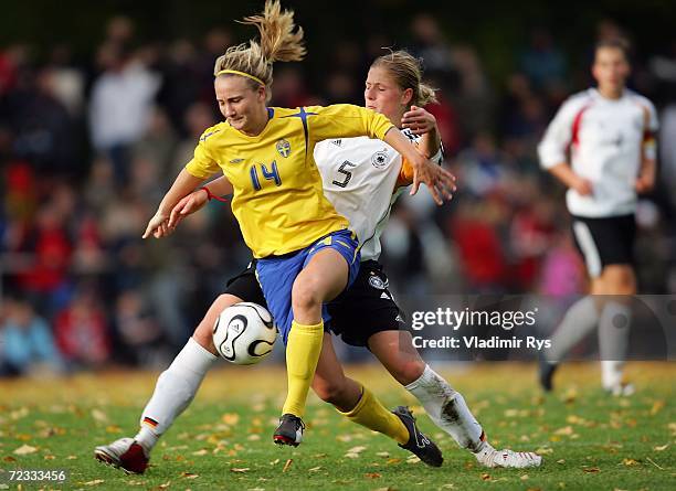 Josephine Schlanke of Germany and Emma Lundh of Sweden battle for the ball during the women's U19 international friendly match between Germany and...