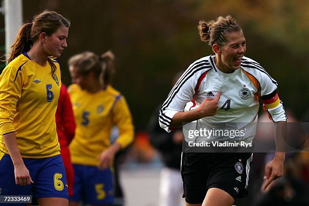 Carolin Schiewe of Germany celebrates after scoring the 2nd goal as Emma Berglund of Sweden looks dejected during the women's U19 international...