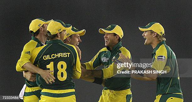 Australian cricket capatin Ricky Ponting , Shane Watson , Adam Gilchrist congratulate teammate Brett lee for taking a catch to dismiss unseen New...