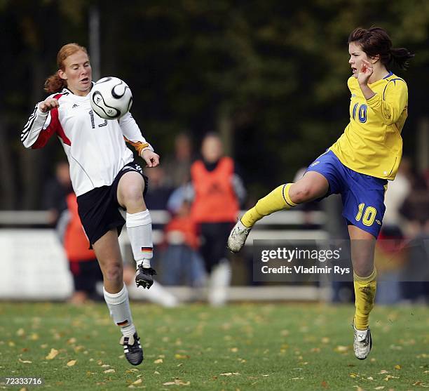 Christina Schellenberg of Germany and Hanna Folkesson of Sweden battle for the ball during the women's U19 international friendly match between...